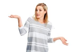 woman-shrug-shoulders-unsure-hands-out-gesturing-uncertainty-47013671